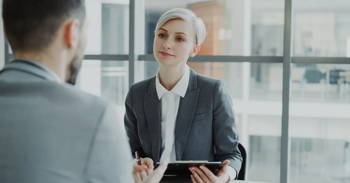 Professional mentorship supporting a collaborative workplace integration process.
