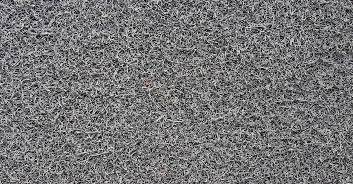 Close-up de um tapete capacho vinil personalizado em área comercial, exibindo sua durabilidade e textura robusta para alta performance.
